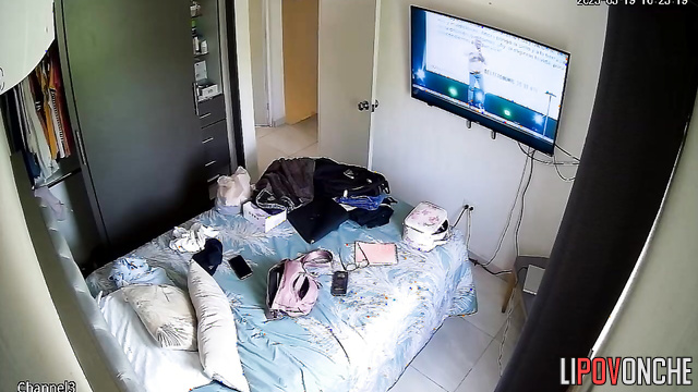 A seductive cutie caresses her naked, sexy body while watching TV