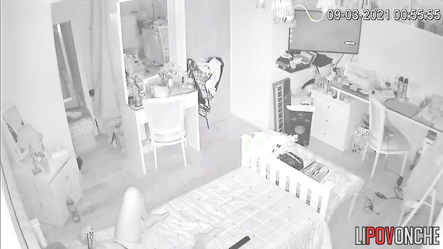 A young cutie slips her fingers into her wet vagina while relaxing in bed