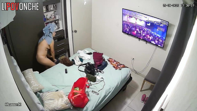 A naked woman with a sexy body puts a panty liner in her underwear