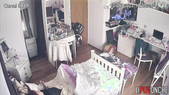 A young college student brings herself to orgasm while watching porn on her phone