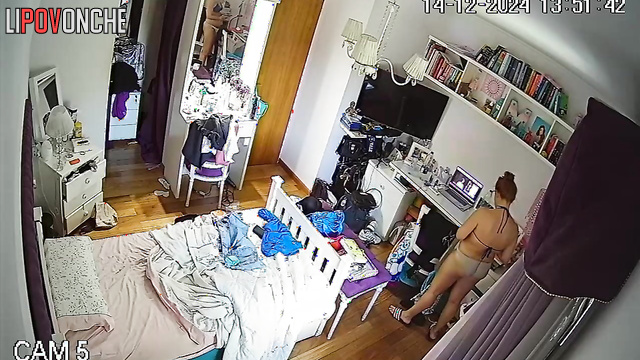 A bored redheaded cutie stripped completely naked in her room
