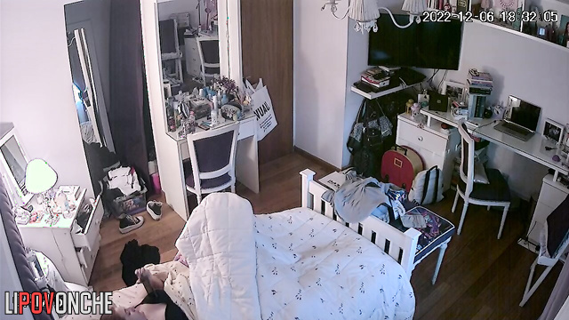 A young girl secretly strokes her tender, wet pussy under the covers