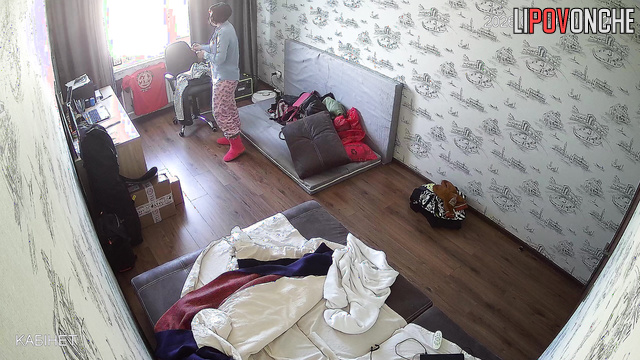 A hidden bedroom camera captured the milf's seductive bare breasts