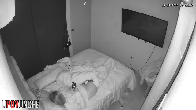 A cutie is messaging on her phone while the vibrator is pressed against her clitoris