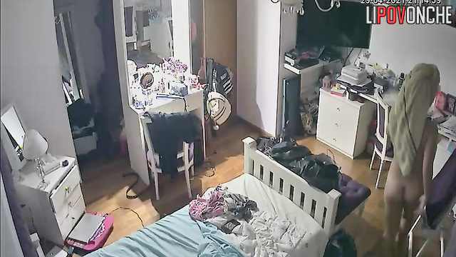 A naked girl is dancing, enjoying the sight of her bouncing tits in the mirror