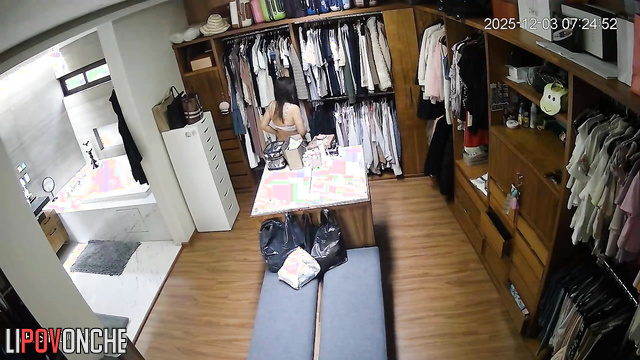 A sultry beauty walks into the locker room wearing seductive white lingerie