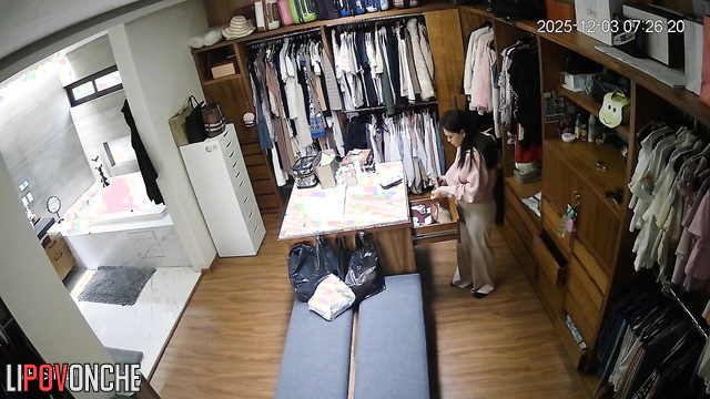 A sultry beauty walks into the locker room wearing seductive white lingerie