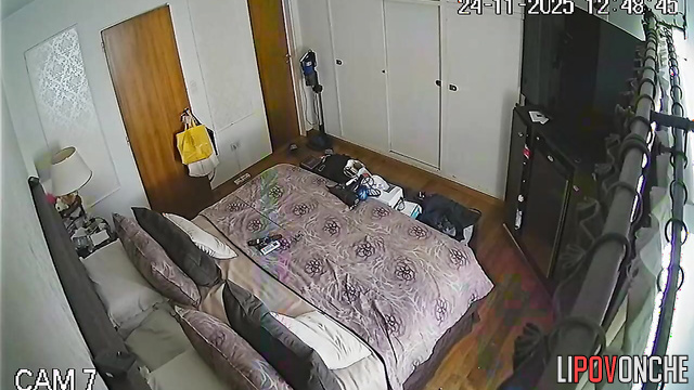 A seductive mommy with a shaved pussy walks out of the bathroom completely naked