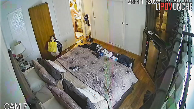 A seductive mommy with a shaved pussy walks out of the bathroom completely naked