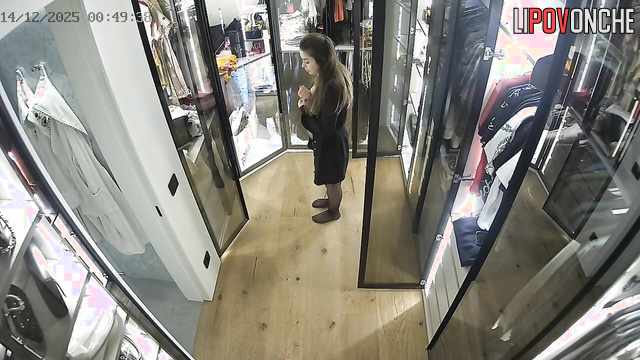 A slim beauty strips down to her panties in front of the camera in the locker room