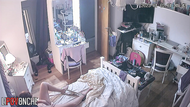 A redheaded beauty takes off sexy panties and wipes her shaved pussy with cotton pads