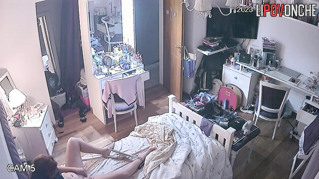 A redheaded beauty takes off sexy panties and wipes her shaved pussy with cotton pads