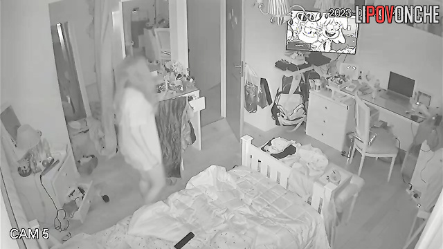 A young girl pulls down her panties to stick a panty liner to them