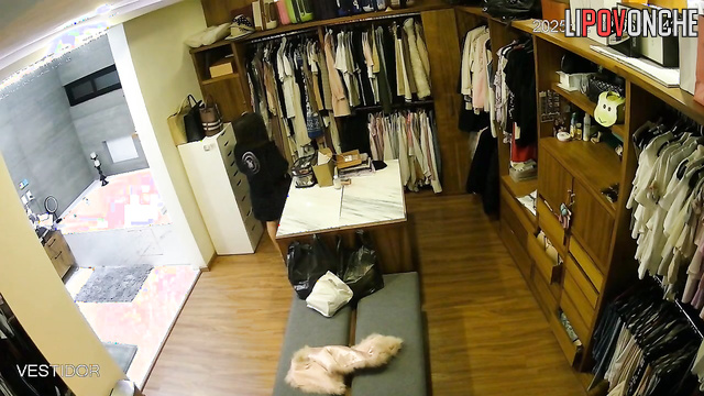 A stunning brunette with big breasts and big nipples gets dressed in the locker room