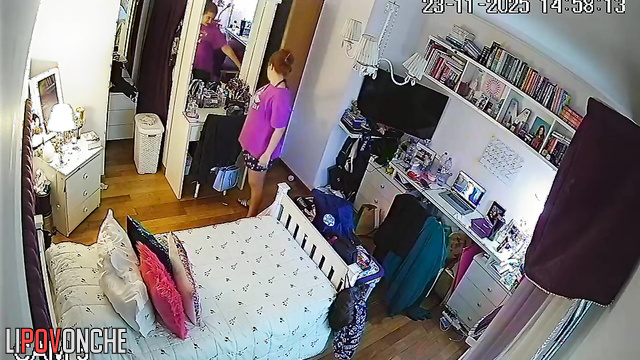 A bored beauty strips completely naked and admires her body in the mirror