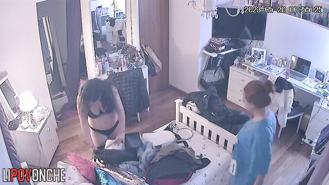 A seductive brunette showed redheaded girlfriend her big naked tits
