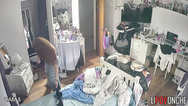 A long-haired cutie bares her perky breasts as she changes her bra