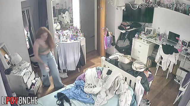A long-haired cutie bares her perky breasts as she changes her bra