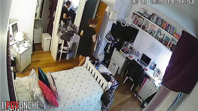 A seductive young woman admires her reflection after trying on a new bra