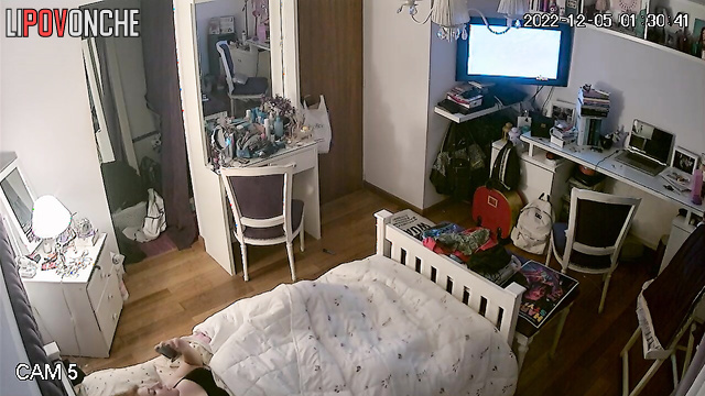 A young girl has a passionate orgasm while intently watching porn on her phone