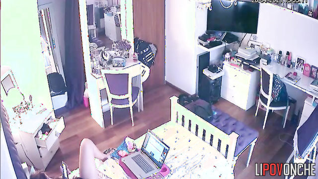 A young cutie listens to music while playing with her wet pussy under her panties