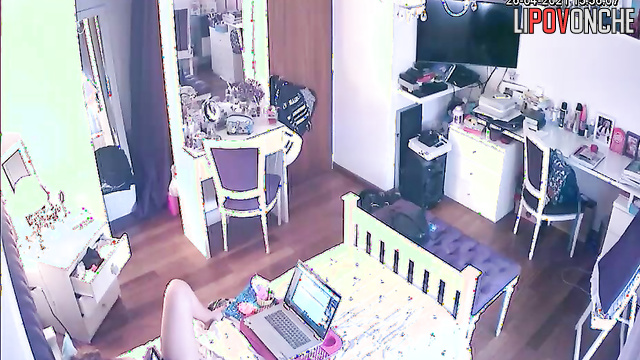 A young cutie listens to music while playing with her wet pussy under her panties