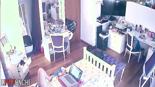 A young cutie listens to music while playing with her wet pussy under her panties