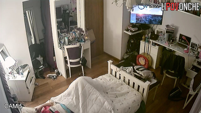 A young beauty got distracted from the movie to watch porn and masturbate