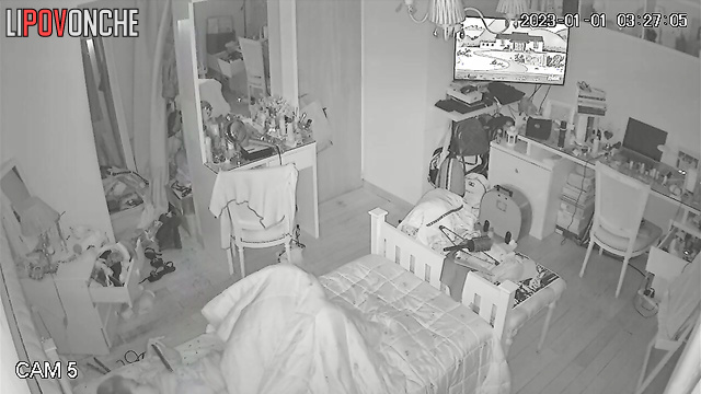 A young redheaded takes off her panties and shines phone's light on wet pussy