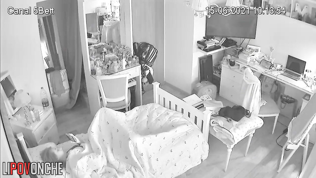 A cute, charming girl sniffs a deodorant can after pulling it out of her vagina