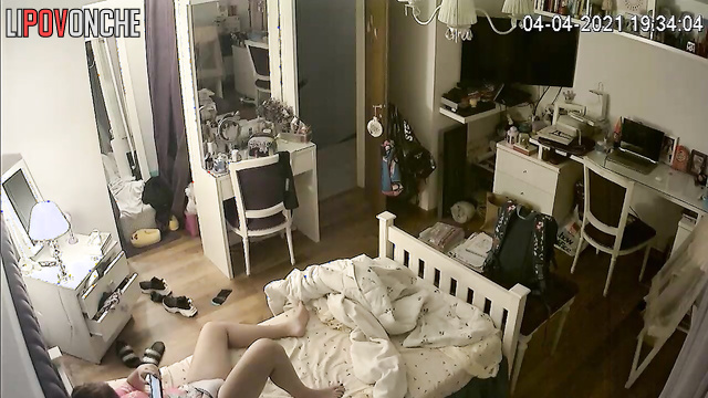 A gorgeous redheaded cutie plays with her sensitive clitoris under her panties