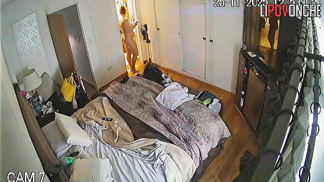A completely naked mommy with red hair and a sexy ass is about to take a shower