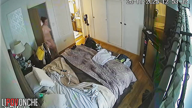 A completely naked mommy with red hair and a sexy ass is about to take a shower