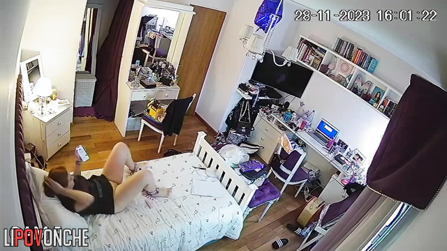 This girl watches adult movies on phone and tries not to cum