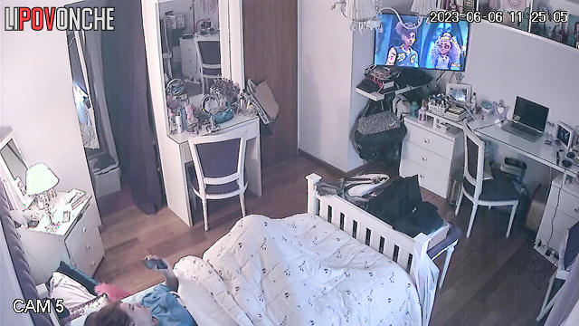 Beautiful chick is laying in her bed and dreams about passionate sex