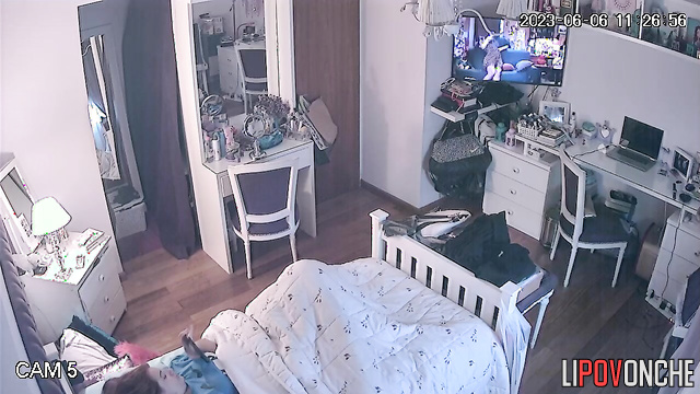 Beautiful chick is laying in her bed and dreams about passionate sex