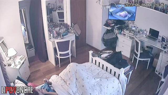 Beautiful chick is laying in her bed and dreams about passionate sex