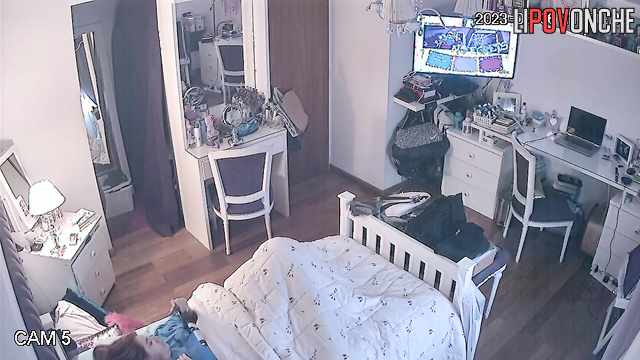 Beautiful chick is laying in her bed and dreams about passionate sex