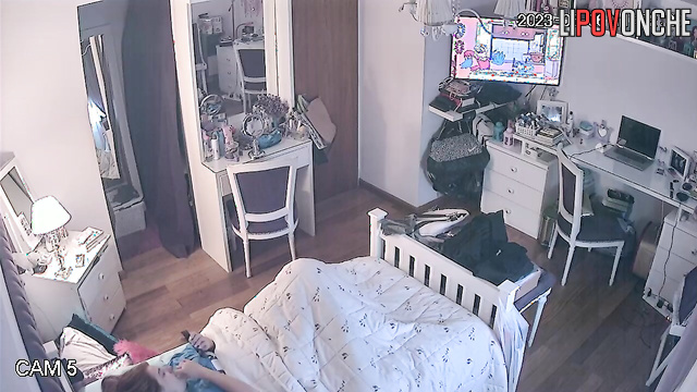 Beautiful chick is laying in her bed and dreams about passionate sex