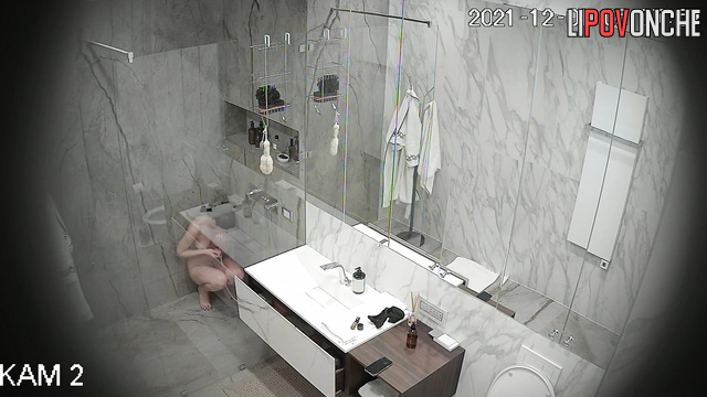 You are invited to join this beautiful girl washing in the bathroom