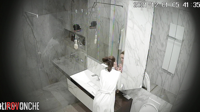 You are invited to join this beautiful girl washing in the bathroom