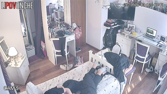 A guy pulls down his redheaded girlfriend's pants and caresses her butt