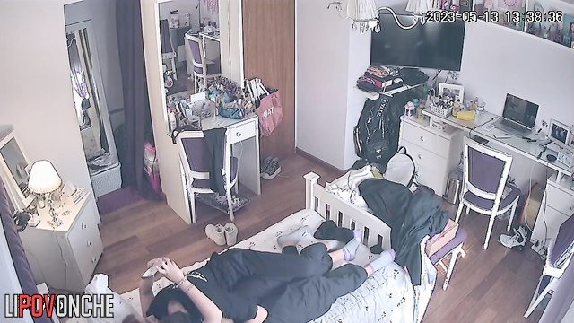 A guy pulls down his redheaded girlfriend's pants and caresses her butt