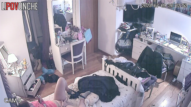 The redheaded girl gently plays with the labia of her hairy cunt