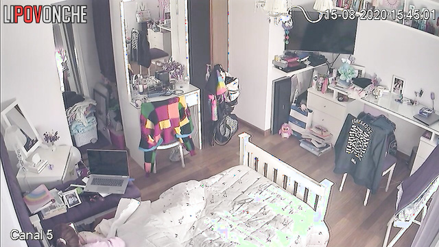 A red-haired teenage girl is secretly watching porn on her phone
