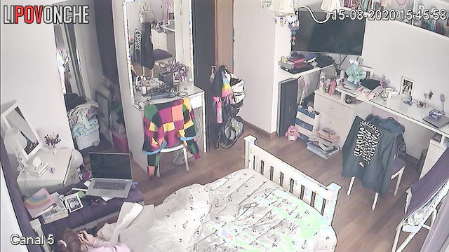 A red-haired teenage girl is secretly watching porn on her phone