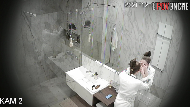 After peeing, a naked beauty with a hairy pussy takes a shower