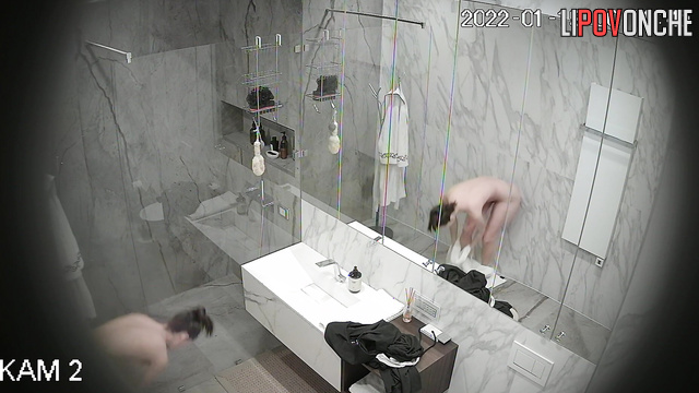 A skinny beauty gently shaves her soft, hairy pussy in the shower