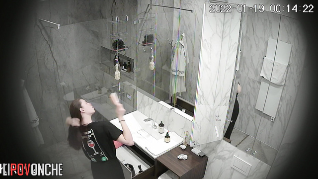 A skinny beauty gently shaves her soft, hairy pussy in the shower