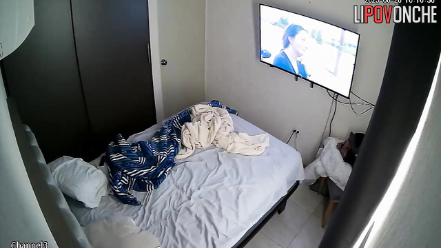 An aroused man secretly starts caressing a young brunette's butt while she sleeps